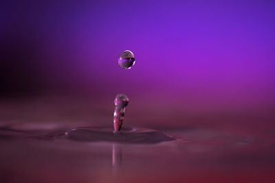 Close-up of splashing droplet on water
