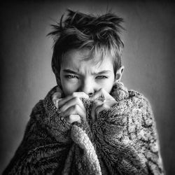 Close-up of boy in fake fur