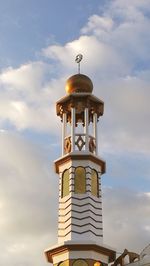 Low angle view of clock tower against sky