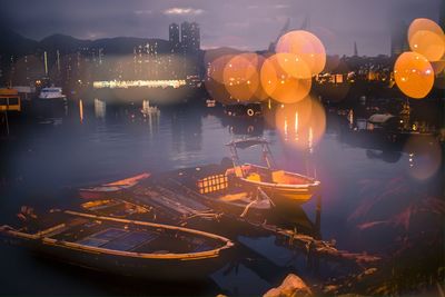 Boats in harbor at night