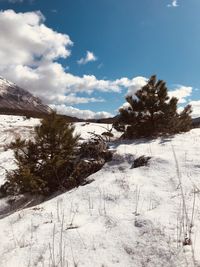 Scenic view of snowcapped mountains against sky