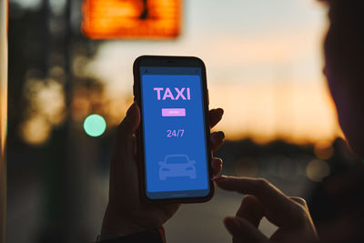 Ordering taxi online using mobile app on smart phone. booking taxi using application online. mobile