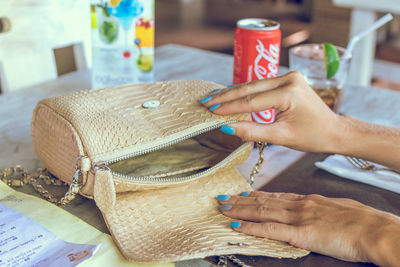 Midsection of woman holding wicker basket