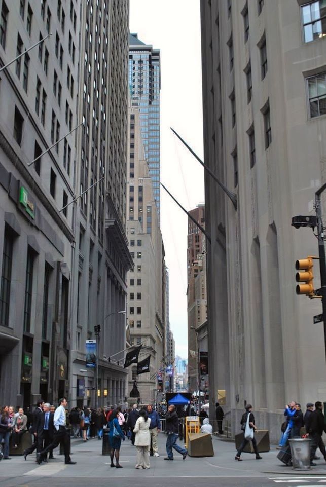 PEOPLE WALKING ON STREET IN CITY