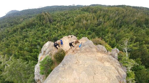 Panoramic view of people on landscape against mountains