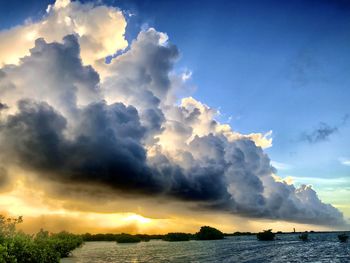 Scenic view of sea against dramatic sky