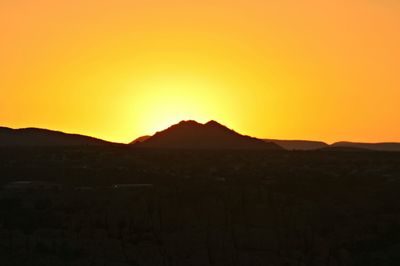 Scenic view of mountains at sunset