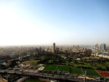 High angle view of buildings in city against clear sky