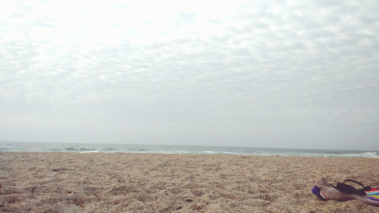 sea, horizon over water, beach, sky, water, shore, scenics, tranquil scene, tranquility, cloud - sky, beauty in nature, sand, cloudy, nature, idyllic, cloud, coastline, day, remote, outdoors