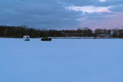 Snow on field against sky