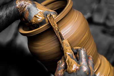 Close-up of sculptor making pot