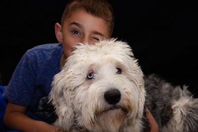 Portrait of cute boy with dog