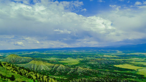 Scenic view of landscape against cloudy sky