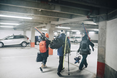 Rear view of people walking in bus