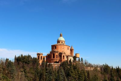 Low angle view of a church building against blue sky