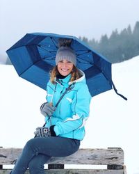 Portrait of a smiling woman in rain