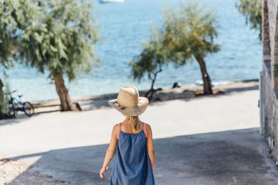 Rear view of woman on beach