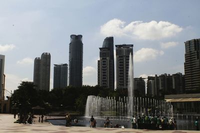 Buildings in city against sky