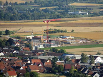 Aerial view of agricultural field against houses