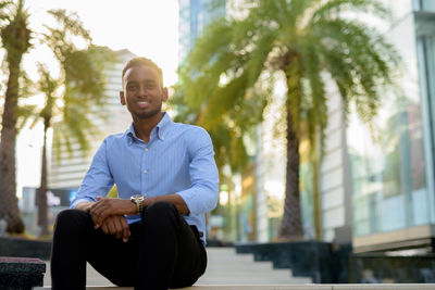 Young man sitting outdoors