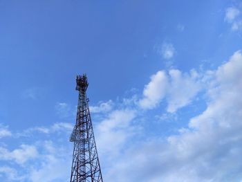 Low angle view of communications tower against sky