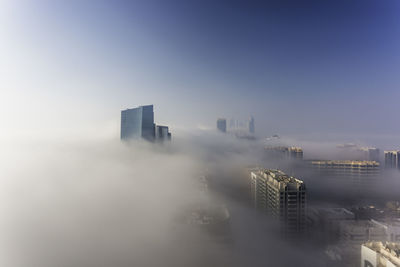 Modern buildings in city against sky