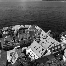 High angle view of buildings by sea