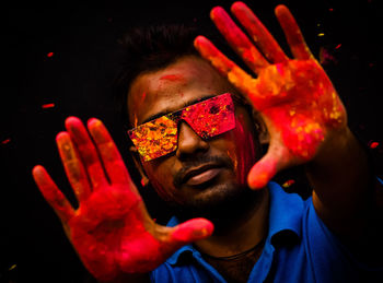 Portrait of a male happy indian celebrating holi with gulal. concept of the indian festival holi.