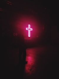 Man in illuminated red light