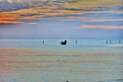 Scenic view of sea at sunset