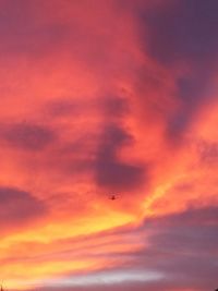 Low angle view of cloudy sky at sunset