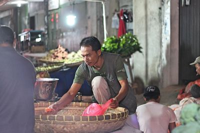 Man selling carrot at market