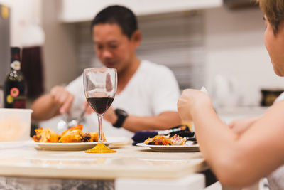 Midsection of woman preparing food in restaurant