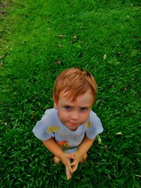 Portrait of smiling boy on grass