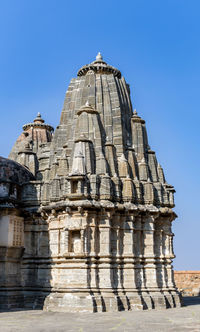 Low angle view of old ruins against clear blue sky