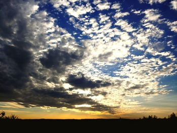 Low angle view of dramatic sky during sunset