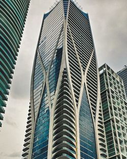 Low angle view of modern buildings against sky in city