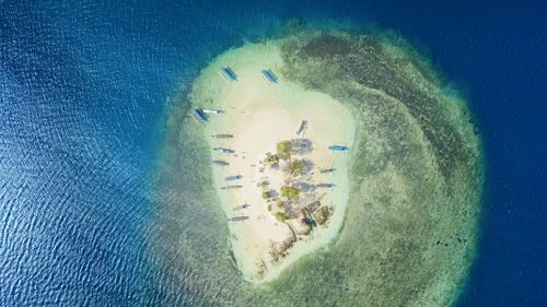 Aerial view of boats moored at beach