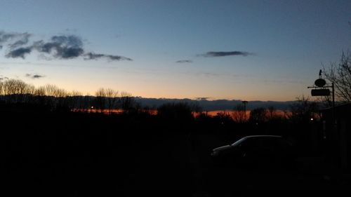 Scenic view of landscape against sky at sunset