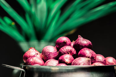 Close-up of onions in container