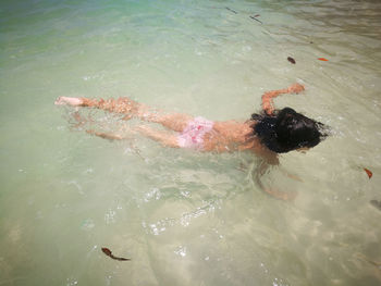 Girl swimming in river