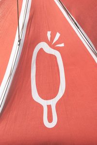 High angle view of text on red surface