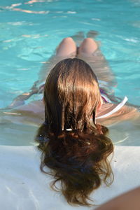 Rear view of woman in swimming pool