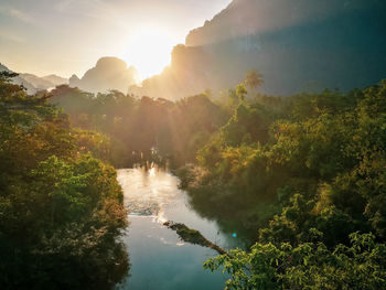 Scenic view of waterfall against sky