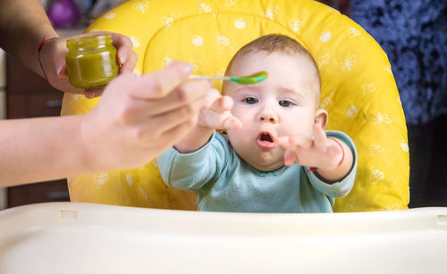 Close-up of boy playing in sink