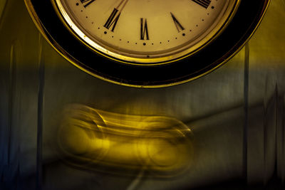 Close-up of clock on wall