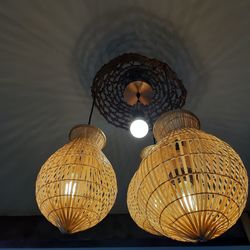 Low angle view of illuminated pendant light hanging from ceiling