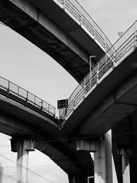 Low angle view of bridge against sky in city