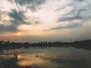 Scenic view of sea against sky at sunset