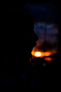 Close-up of silhouette man at sunset